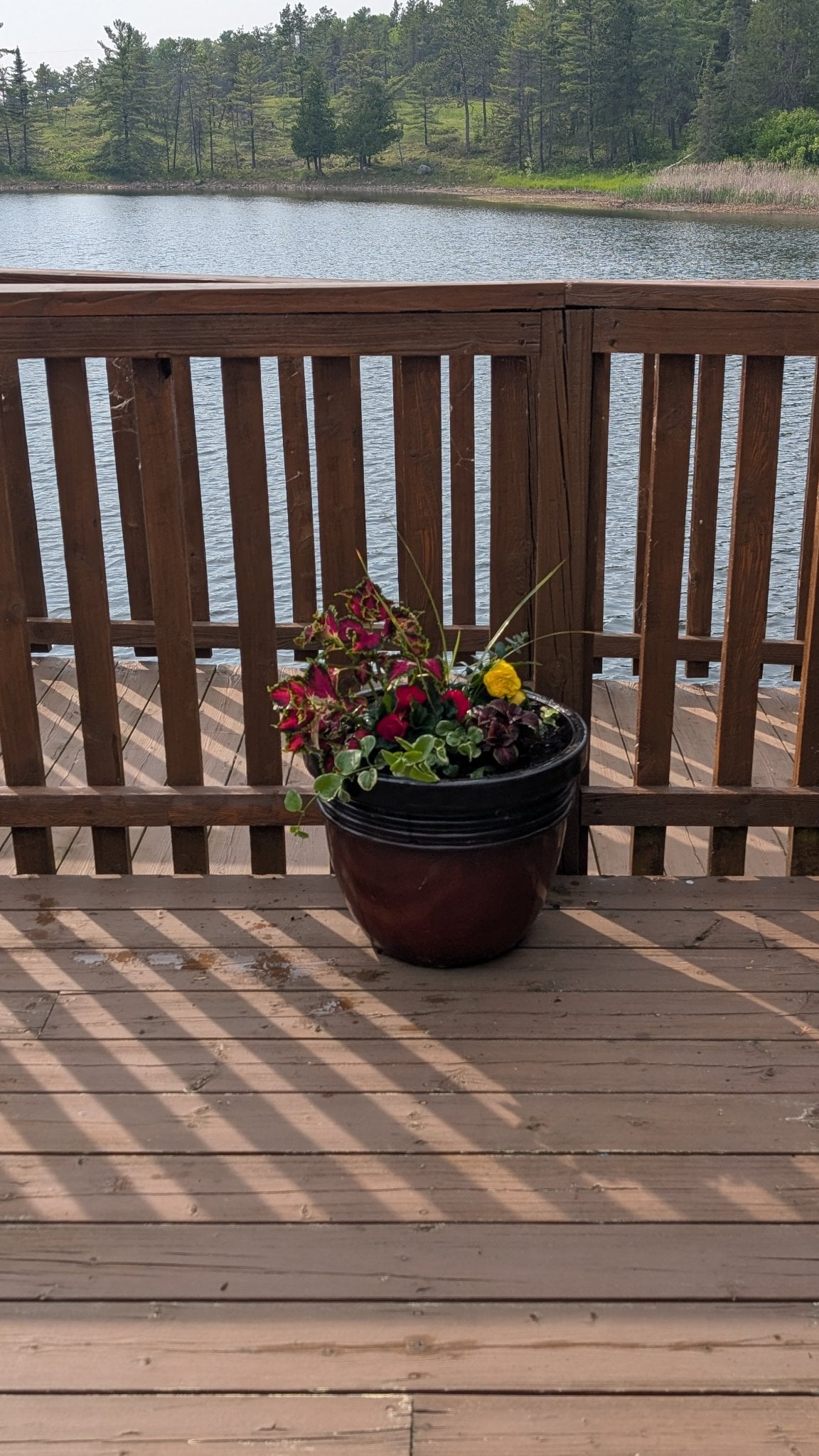 Deck overlooking the Whitefish River — a peaceful spot to relax